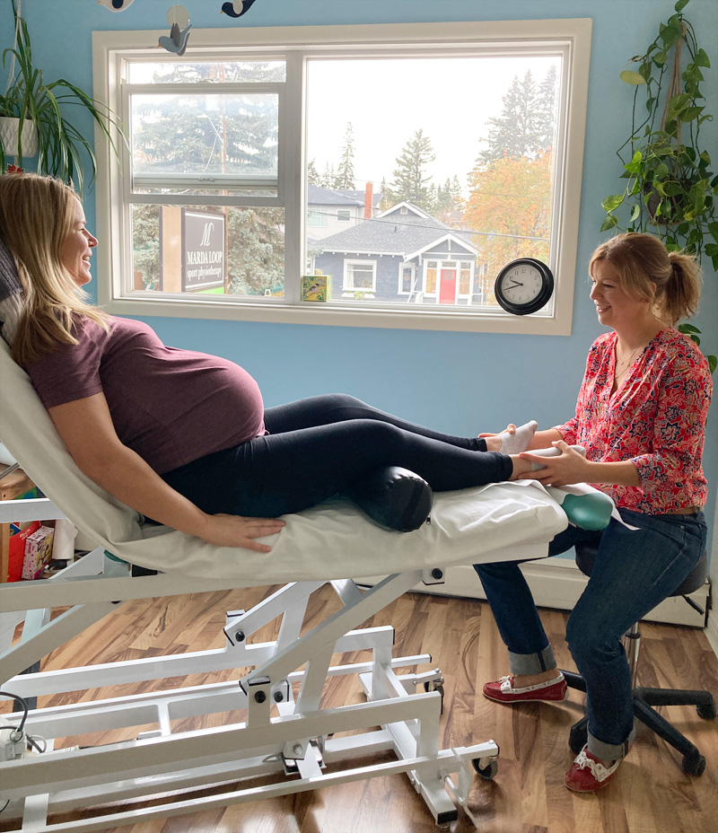 A pregnant patient receives an osteopathic treatment from me